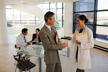 Businessman and doctor talking in meeting