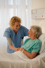 Obraz premium Portrait of smiling doctors and nurse in hospital corridor