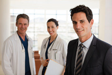 Obraz premium Portrait of serious doctor in hospital corridor