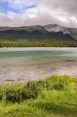 Fototapeta na wymiar Maligne Lake in cloudy day in summer in Jasper in Banff National Park, Alberta, Canada