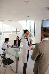 Portrait of serious doctor in hospital corridor