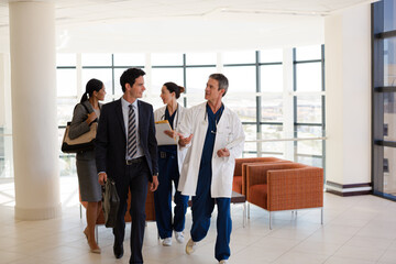 Doctors talking in hospital corridor