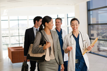 Portrait of smiling doctor in meeting