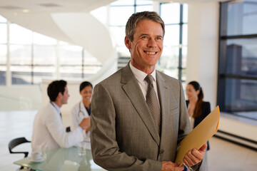 Portrait of doctor and aging patient in hospital room
