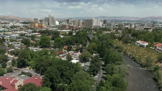 Aerial: Truckee River and city skyline. Reno, Nevada, USA