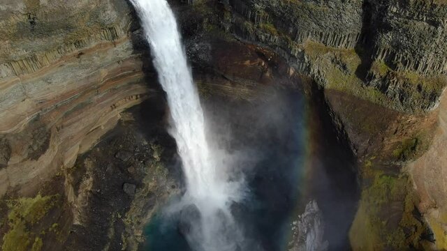 Rainbow at Haifoss waterfall in Iceland, aerial view