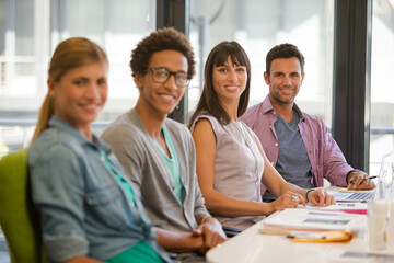 Portrait of business people smiling in meeting