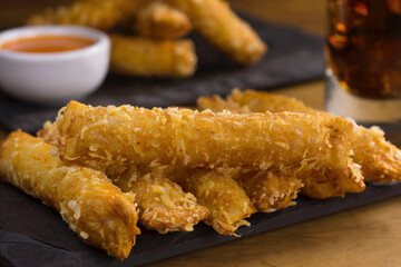 Traditional Brazilian fried snack made with han and cheese called Cigarrete