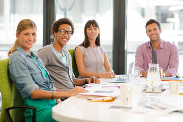 Portrait of business people smiling in meeting