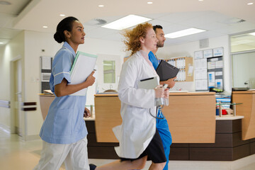 Hospital staff rushing down hallway