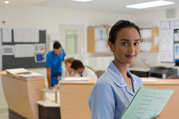 Nurse standing in hospital hallway