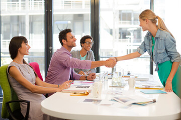 Business people shaking hands in meeting