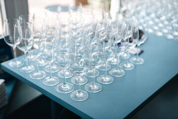 Empty champagne glasses on a blue table 