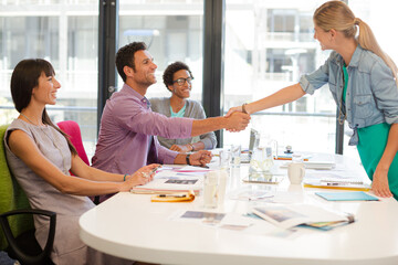 Business people shaking hands in meeting
