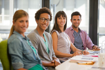 Portrait of business people smiling in meeting