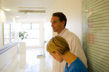 Nurse and doctor talking in hospital