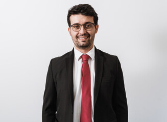 Young Latino businessman or lawyer on white background.
