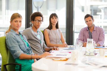Fototapeta premium Portrait of business people smiling in meeting