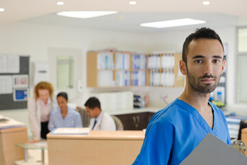 Doctor smiling in hospital hallway