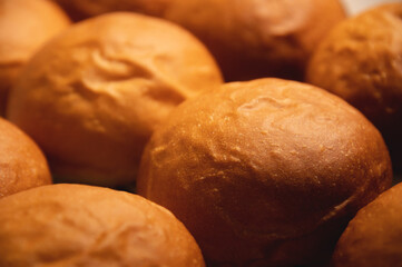 Cheeseburger or hamburger buns. Freshly baked buns are on the tray