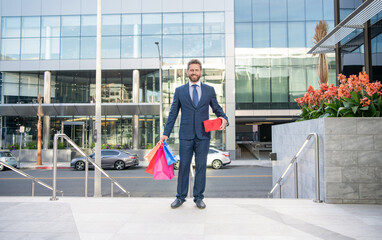 happy business man in formalwear outdoor with shopping bags for holiday, full length, shopping.