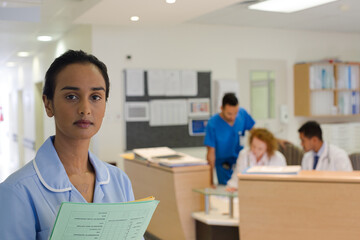 Fototapeta premium Nurse standing in hospital hallway