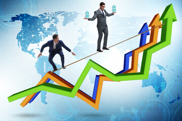 Fototapeta premium Businessman balancing on tightrope on line chart