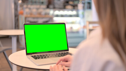 Close Up of Woman Looking at Laptop with Green Chroma Key Screen, Rear View