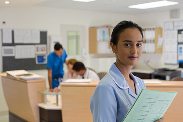 Nurse standing in hospital hallway