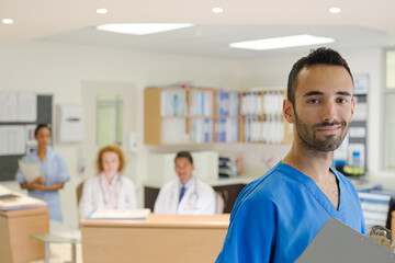 Fototapeta premium Doctor smiling in hospital hallway