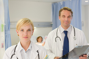Fototapeta premium Doctors examining x-rays in hospital room