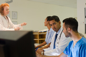 Fototapeta premium Hospital staff talking at front desk