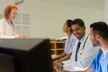 Fototapeta premium Hospital staff talking at front desk