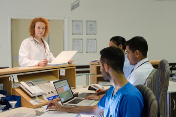 Fototapeta premium Hospital staff talking at front desk