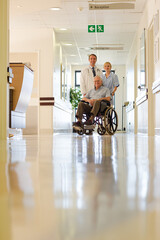 Doctor and nurse with older patient in hospital