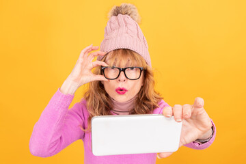 portrait of woman with mobile phone isolated taking picture with winter hat