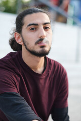 Obraz premium Close up portrait of handsome Arab man walking in the park