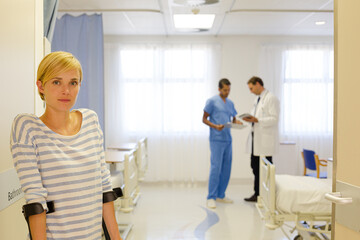 Fototapeta premium Patient using crutches in hospital room