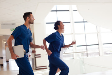 Hospital staff rushing down hallway