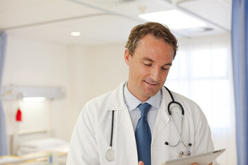 Doctor smiling in hospital room