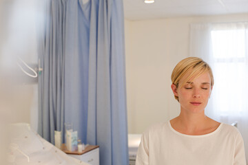 Patient sitting on hospital bed