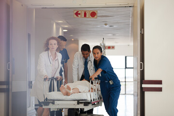 Hospital staff rushing patient to hospital room