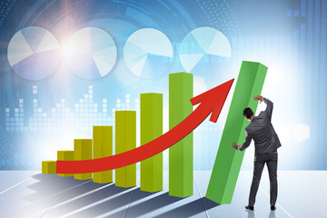 Businessman supporting economic growth on chart
