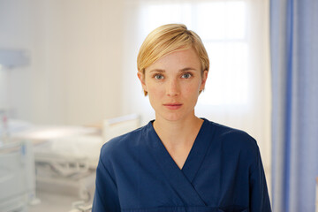 Nurse standing in hospital hallway