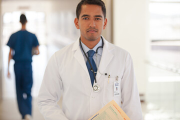 Fototapeta premium Doctor smiling in hospital hallway