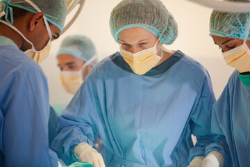 Surgeons working in operating room