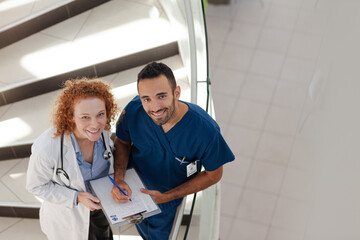 Doctor and nurse on hospital steps