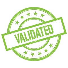 VALIDATED text written on green vintage stamp.