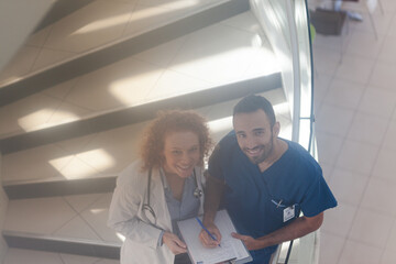 Doctor and nurse on hospital steps