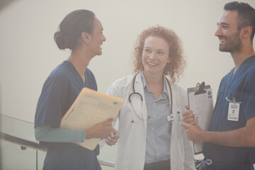 Fototapeta premium Hospital staff talking near staircase
